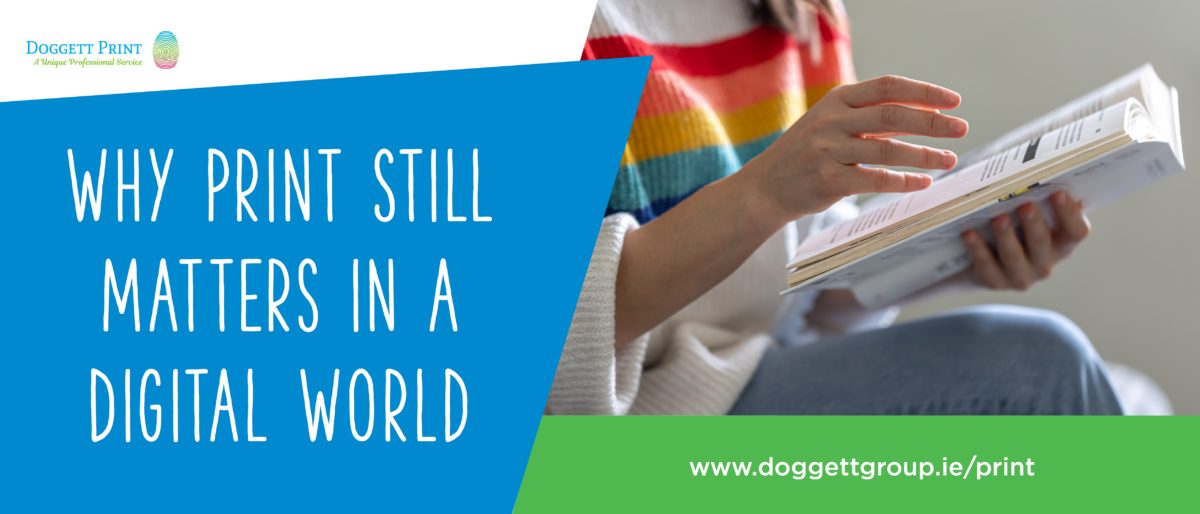 Woman holding and reading a printed magazine in her hands.