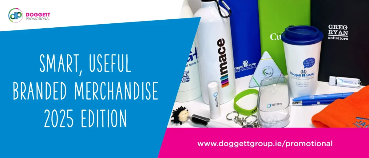 A colourful display of custom branded promotional products including mugs, bottles, notepads and pens.