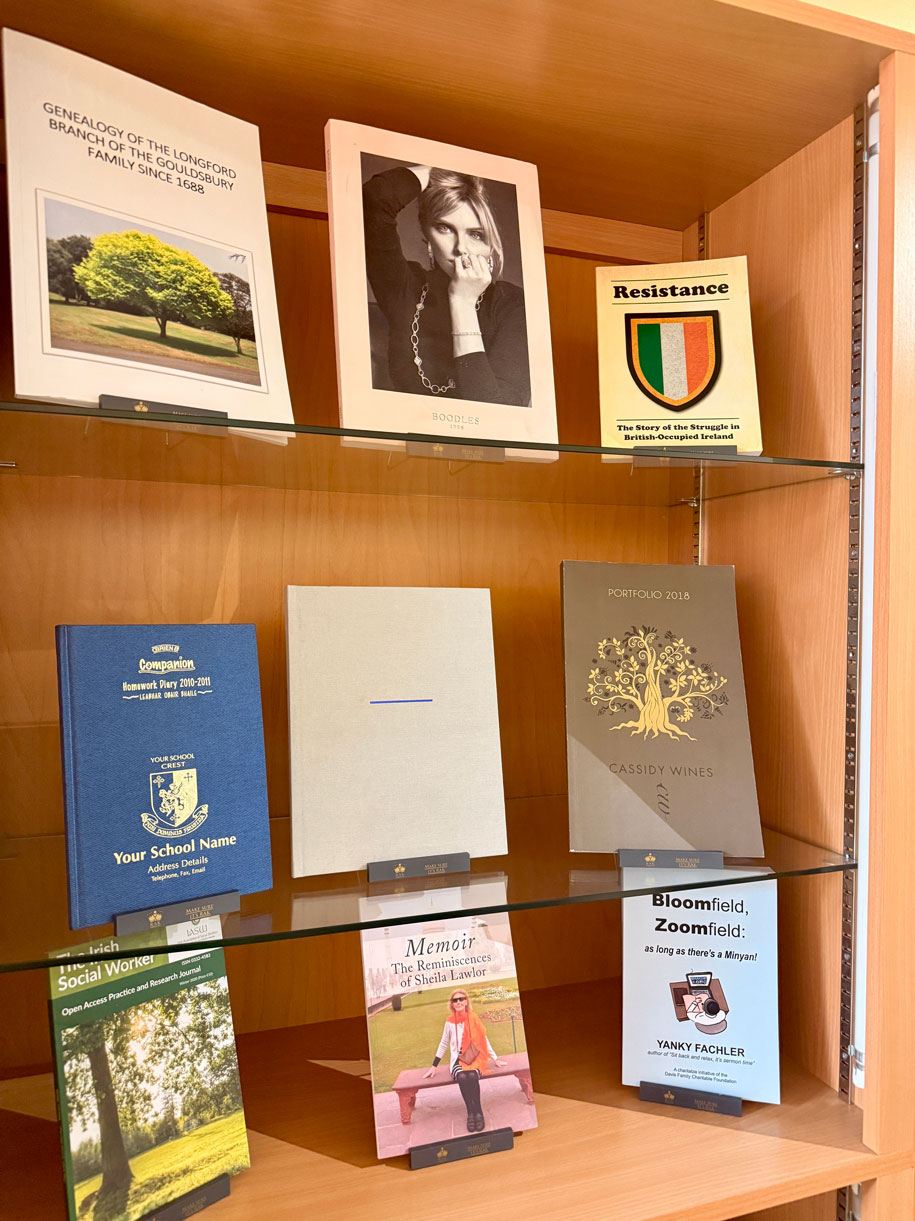 Books on shelf display projects by Doggett Group